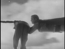 Clark's first appearance as Superman, rescuing the man dangling on a rope from a dirigible