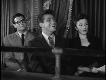 Clark, Jimmy, and Lois watching, Jimmy with great amusement