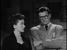 Lois and Clark glance at each other
