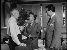 Perry White talking to Lois and Clark