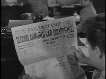 Jimmy reads paper on the secon robbery