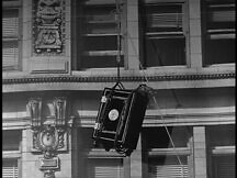 The safe being lowered out of the building