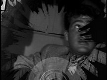 Clark sees with his x-ray vision that Jimmy's in the safe