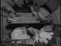 Superman looks inside safe with his x-ray vision