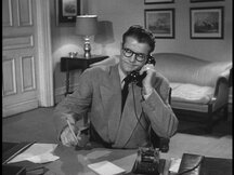 Clark picks up the phone and a pencil